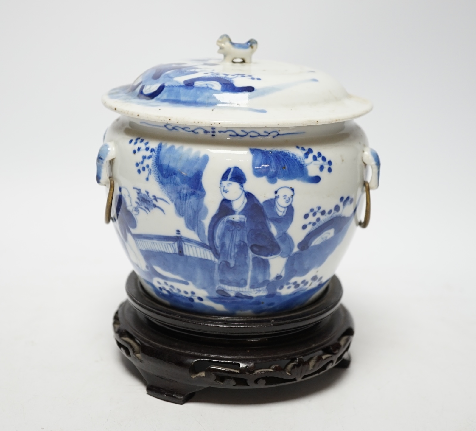 A Chinese Straits blue and white bowl and cover, kamcheng, late 19th century, with twin handles, on hardwood stand, 19cm high